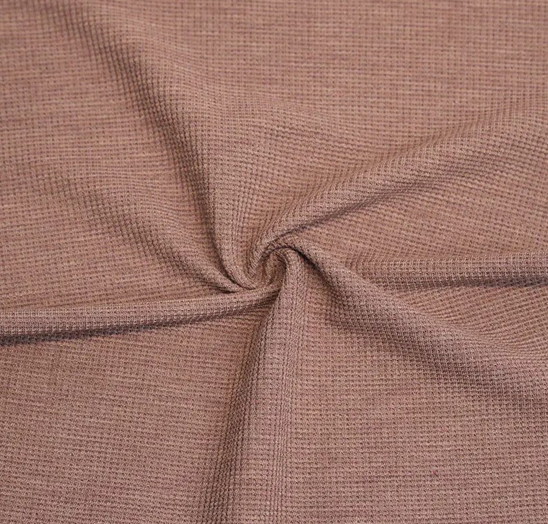 Comment la structure des gaufres affecte-t-elle les performances de la gaufre d'étirement en bambou / polyester?
